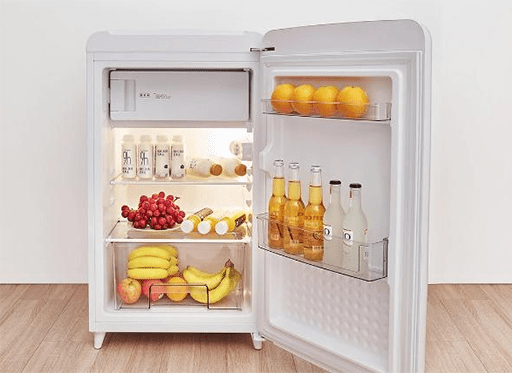 a fridge is opened on the floor